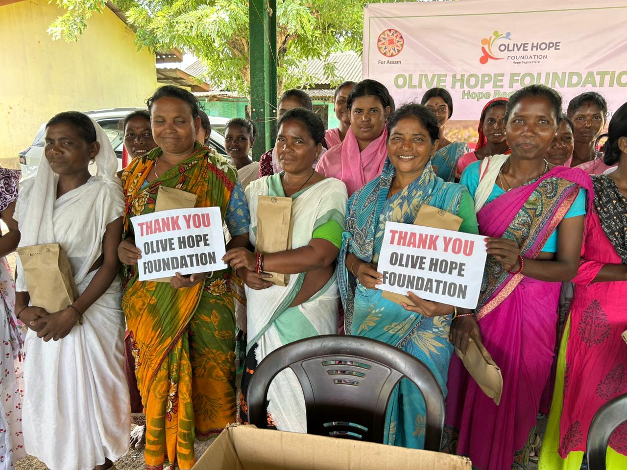 Women community members receiving support from Olive Hope Foundation